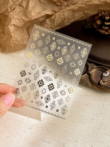 Macro detail of Bohemian gold foil nail art stickers with vintage European patterns YT-201