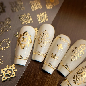 Gold baroque bohemian nail stickers with embossed vintage patterns on cream white base