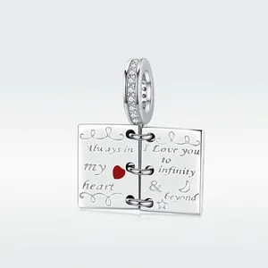 925 sterling silver open book charm with heart engraving and sparkling cubic zirconia