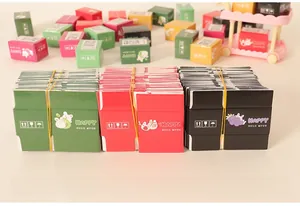 Flat-packed and assembled 1:12 miniature dollhouse shipping boxes with colorful patterns