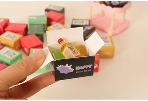Miniature cardboard boxes with tiny wine bottles for dollhouse food play sets