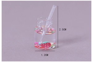 Detailed size view of miniature resin fruit juice bottle showing 2.5cm height and fruit slices