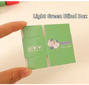 Detailed close-up of a light green miniature dollhouse blind box cardboard model