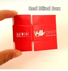 Miniature red shipping box toy with cartoon bunny held in hand for scale and detail