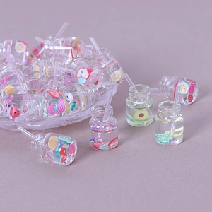 Miniature resin juice bottles with fruit slices and straws for DIY crafts and decor