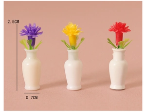 Detailed view of three 2.5cm miniature vases with colorful flowers for dollhouse decor
