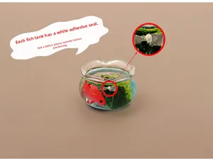 Macro detail of a dollhouse miniature aquarium with red fish and green aquatic plants