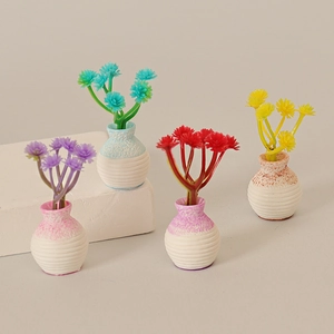 Miniature dollhouse flower pots set with colorful blossoms and spiral textured vases