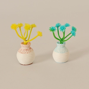 Miniature dollhouse potted plants with yellow and green flowers in textured vases