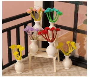 Detailed macro view of six miniature dollhouse vases with colorful synthetic flower bouquets