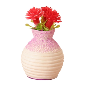 Miniature dollhouse ceramic vase with red faux flowers and detailed honeycomb texture