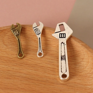 Miniature metal wrench charms in silver and bronze for dollhouse DIY craft decoration