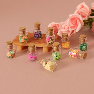Miniature glass jars with colorful clay fruit slices for dollhouse decor and DIY crafts