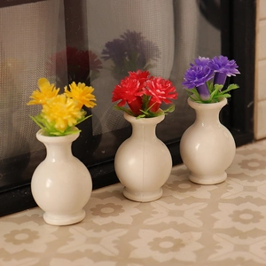 Three miniature dollhouse flower vases in red, yellow and purple for micro landscape decor
