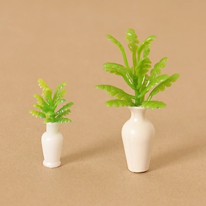Set of two miniature dollhouse potted plants in white vases for desktop decoration