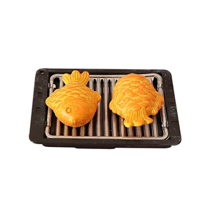 Miniature dollhouse BBQ grill with two realistic sea bream fish cakes for home decoration
