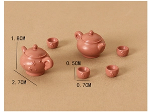 Miniature clay teapot set with floral relief and precise size dimensions in centimeters
