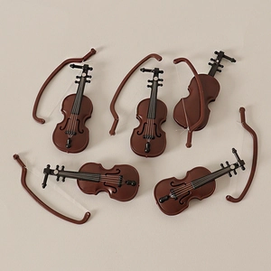 Set of six miniature violins with bows for dollhouse decoration and creative DIY projects