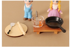 Miniature dollhouse kitchen set with frying pan whisk and rolling pin on wood base