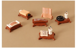 Detailed macro view of miniature resin Chinese lute and ancient Go board dollhouse accessories