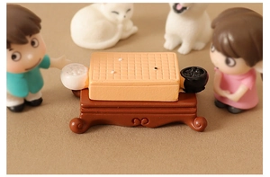 Miniature Go board game set with grid board and resin bowls on vintage carved base