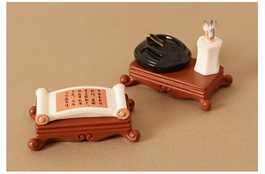 Detail of miniature Chinese study set with scroll, inkstone and brush holder on base