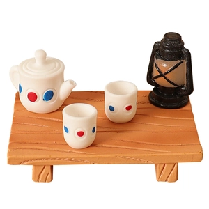 Miniature dollhouse tea set with lantern on wood bench for DIY garden decor