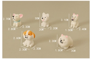 Detailed size view of five assorted miniature resin puppy figurines for dollhouse decor