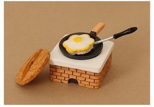 Miniature brick-textured stove with frying pan and egg for dollhouse kitchen decor