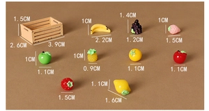 Detailed macro view of dollhouse miniature wooden fruit basket with resin apples and grapes