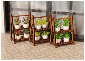 Miniature wooden plant stands with tiny white potted greenery for dollhouse garden scenes