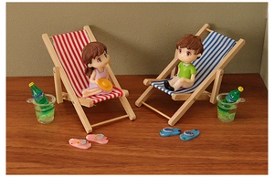 Miniature wooden folding beach chairs with striped fabric and tiny beverage accessories