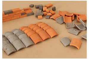 Miniature dollhouse bricks and curved roof tiles in red and grey for building models