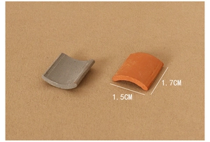Detailed view of 1.5x1.7cm miniature clay dollhouse roof tiles in grey and terracotta