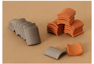 Macro shot of miniature roof tiles in grey and terracotta for dollhouse scenery
