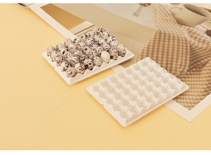 Miniature dollhouse egg tray with tiny resin eggs on warm yellow background scene
