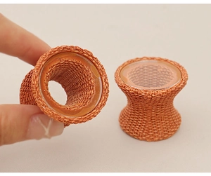 Detail of orange knitted chair leg protector with flexible silicone inner lining
