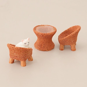 Miniature dollhouse furniture set with resin woven tables, chairs and a sleeping cat