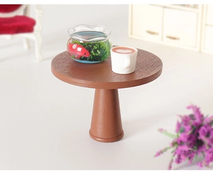 Miniature round table with tiny goldfish bowl and coffee cup for dollhouse scenes