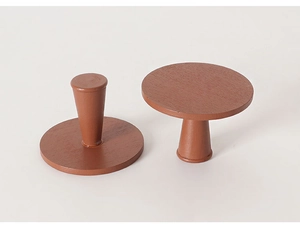 Detail view of two miniature mahogany-colored wooden round tables for dollhouse decor