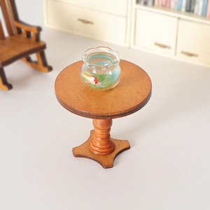 Miniature round walnut wooden table with a tiny goldfish bowl for dollhouse decor