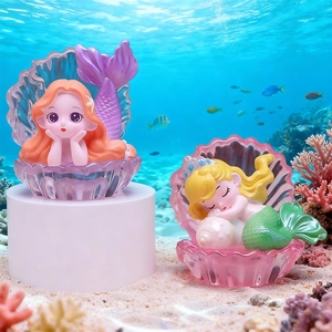 Luminous mermaid princess blind box figurines with shell bases on ocean floor