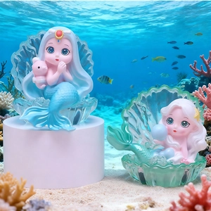 Mermaid princess glowing figurines in shell base with coral undersea background