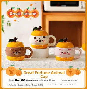 Detail of 420ml ceramic mugs with cute animal designs and orange-shaped lids