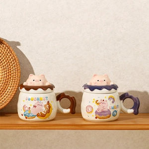 Detail of ceramic mugs with 3D pink pig lids and decorative wave pattern handles