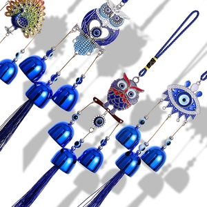 Mediterranean Evil Eye wind chime with metal bells and blue tassels for home decor