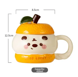 Detailed view of a 420ml orange shaped ceramic mug with Good Lucky text and green leaf lid