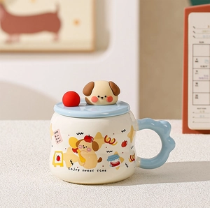 Detail of cute cartoon ceramic mug with 3D dog lid and blue wavy handle for coffee