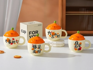 Detail view of creative ceramic mugs with orange-shaped lids and Chinese blessing phrases