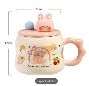 Detail of a 400ml cream ceramic mug with a pink 3D rabbit lid and cute cartoon patterns